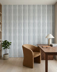 Chambray Ticking soft blue striped wallpaper adding character to a cozy bedroom