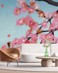 Pink cherry blossoms on sky blue removable wallpaper in contemporary living room setting
