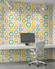 Chromatic Echoes retro colorful geometric wallpaper as a feature wall in a bright home office