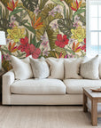 A lavish mix of bright, richly hued tropical blooms and large green leaves, forming an eye-catching design.