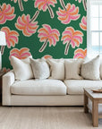 Stylized palm illustrations, vibrant and electric, jump off the dark canvas; an example of modern pop art