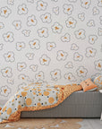 Removable wall covering showcasing a whimsical repeated pattern of fluffy white and toasted brown popcorn - Cinema Swirl