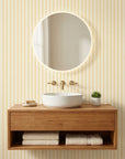 Citrine Column yellow striped peel and stick wallpaper creating ambiance in a serene bathroom