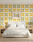 Citrus Bloom yellow lemon and green geometric tile wallpaper adding character to a cozy bedroom