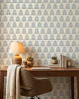 Clipped Dreams blue botanical tree wallpaper creating ambiance in a serene bathroom