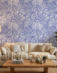 Cobalt Canopy blue leaf wallpaper in a warm and inviting living room