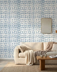 Concrete Drift blue & grey abstract wallpaper in a warm and inviting living room