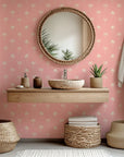 Minimalist palm tree pattern in pink and cream tones on peel and stick wallpaper