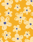 Cheerful ochre wallcovering featuring an outlined floral design in cream, known as Cosmic Bloom