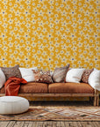 Whimsical floral motif in cream sketched onto a mustard yellow background, known as Cosmic Bloom