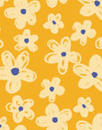 Cheerful ochre wallcovering featuring an outlined floral design in cream, known as Cosmic Bloom