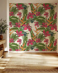 Vibrant red hibiscus flowers and orange bird of paradise blooms on a removable wallpaper