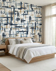Crosshatch Canvas navy blue and beige abstract brushstroke wallpaper adding character to a cozy bedroom