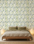 Crossroads green geometric peel and stick wallpaper adding character to a cozy bedroom