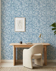 Deep Current coastal blue abstract wallpaper as a feature wall in a bright home office