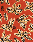 Removable wallpaper featuring an abstract floral sketch in rust orange and black tones