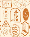 Warm clay-toned wallpaper adorned with classic Western symbols: cowboy boots, snakes, desert shapes, moons, and horseshoes