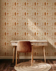 Patterned wallpaper decorated with classic Frontier symbols: horseshoes, boots, snakes, and moons, set against desert imagery and colored in dusty orange and clay shades