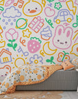 Removable vinyl wall covering displaying a dense pattern of charming cartoon creatures and bright artistic doodles - Doodle Dreams