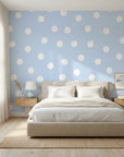 Dream Drops light blue polka dot wallpaper adding character to a cozy bedroom