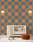 Drift & Scatter abstract blue and orange wallpaper bringing warmth to a peaceful nursery