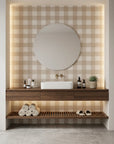 Dune Plaid warm beige gingham check wallpaper creating ambiance in a serene bathroom