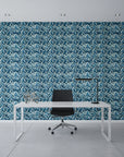 Dusk Feather indigo ikat leaf wallpaper as a feature wall in a bright home office