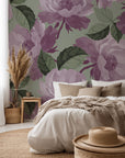 Hand-painted wallpaper featuring mauve roses and blooms on a soft sage green backdrop (Dust Bloom)