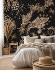 Peel and stick wallpaper, 'Earthen Whispers,' presenting a dark, moody traditional paisley pattern in black and deep brown.