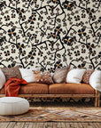 Self-adhesive wall covering in a contemporary cream tone, patterned with black botanical branches (Ebony Bloom)