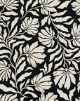 Cream and black wallpaper featuring a floral silhouette design, easily applied with peel-and-stick backing