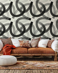 Abstract geometric wallpaper, Echo Bound, featuring black and cream flowing curved lines.