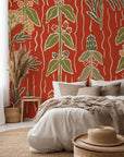 Ember Meadow self-adhesive wall covering featuring a botanical herb pattern in earthy red and verdant green