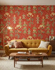 Ember Meadow terracotta and green wildflower wallpaper in a warm and inviting living room