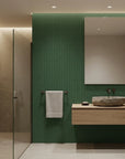 Emerald Slant forest green abstract wallpaper creating ambiance in a serene bathroom