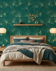 Emerald Veil refined green and gold ginkgo leaf mural wallpaper in a warm and inviting living room
