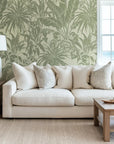 Retro-style tropical leaf wallpaper in a monochromatic sage green hue with self-adhesive backing