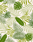 Removable wallpaper featuring vibrant green monstera and palm leaves in a tropical pattern