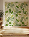 Vibrant green tropical palm and monstera foliage on self-adhesive wallpaper