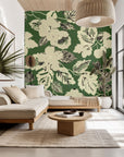 Distressed botanical floral wallpaper in cream and green, featuring a peel-and-stick backing (Ethereal Grove)