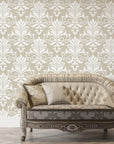 Taupe and ivory Ethereal Flowers damask wallpaper displayed on living room wall with vintage sofa