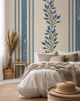 Self-adhesive cream and blue vertical striped wallpaper featuring a botanical vine print