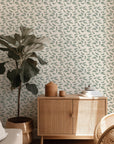 Wallpaper with a pattern of lush green palm fronds set against an achromatic background