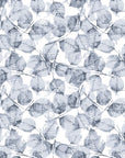Fallen Leaves blue and grey botanical wallpaper adding warmth to an elegant dining room setting