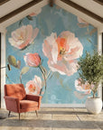 Coral and pink First Blush floral wallpaper on sunlit accent wall with painted botanical blooms