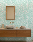 First Bloom aqua floral peel and stick wallpaper creating ambiance in a serene bathroom