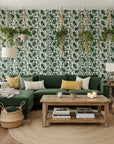 Foliage Fragments dark green tropical leaf wallpaper in a warm and inviting living room