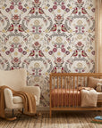 Folk Garden wallpaper with burgundy birds and botanical motifs on cream background in modern nursery