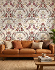 Folk Garden removable wallpaper with burgundy birds and floral motifs on living room accent wall