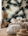 Peel-and-stick wallpaper featuring a contemporary pattern of grey and beige geometric triangles, named Fractured Light